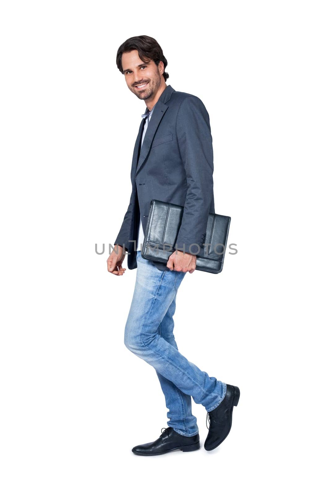 Stylish young man with dark hair and beard successfully isolated against white background