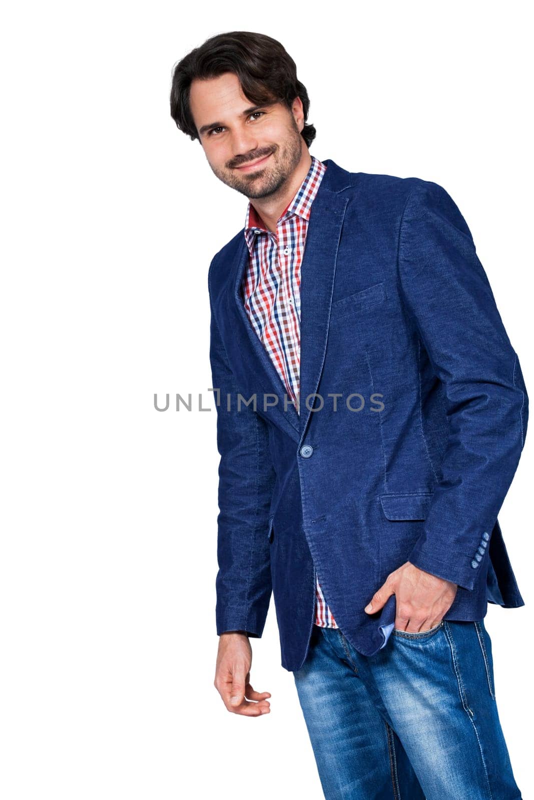 Young man in trendy casual look with dark hair and beard isolated against a white background