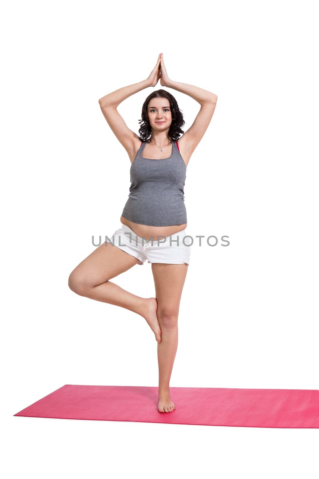 Young attractive mother in swing at training isolated against white background