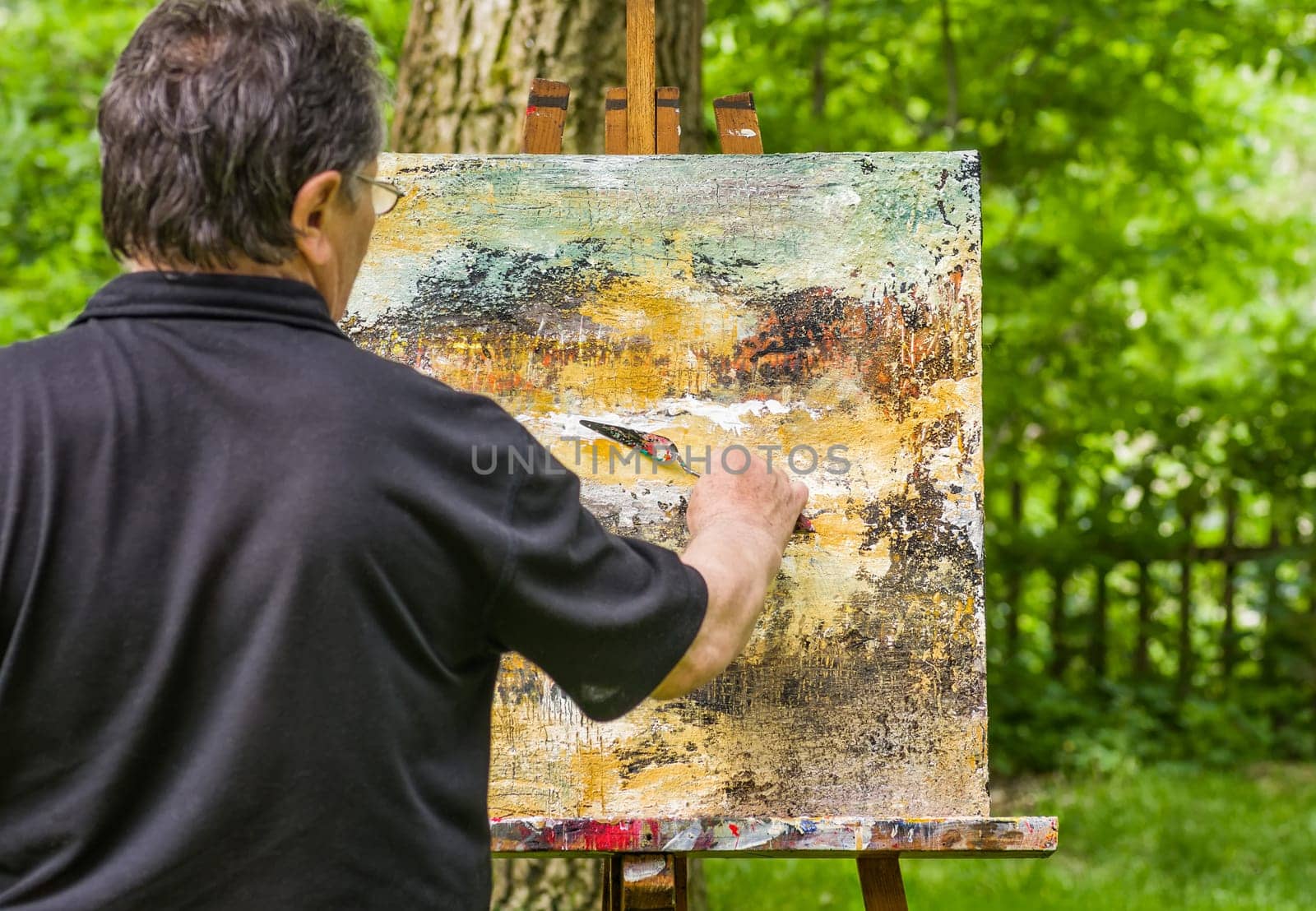 Artist paints an abstract image