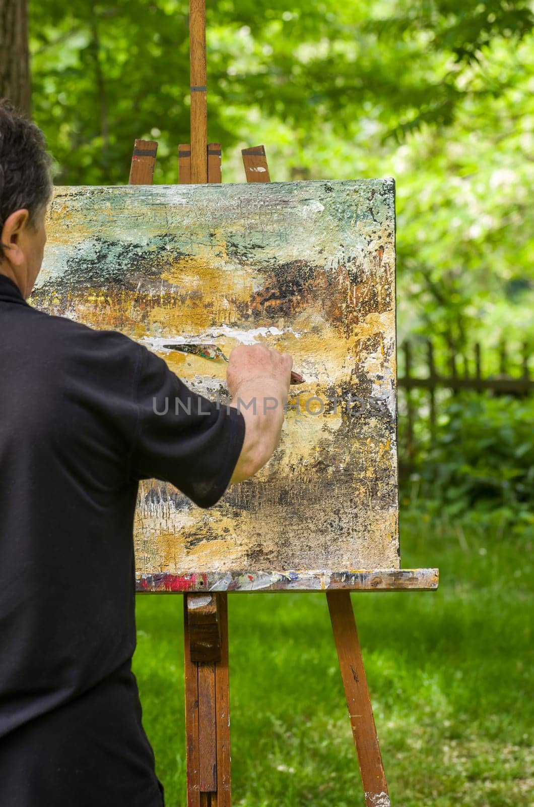 Artist paints an abstract image