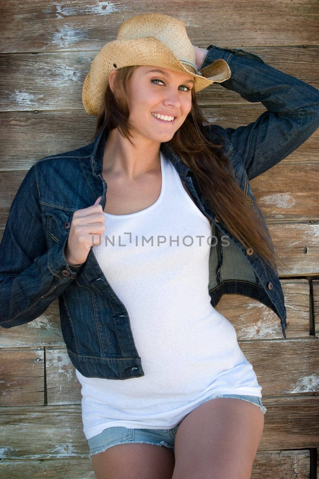 Pretty smiling denim jacket cowgirl