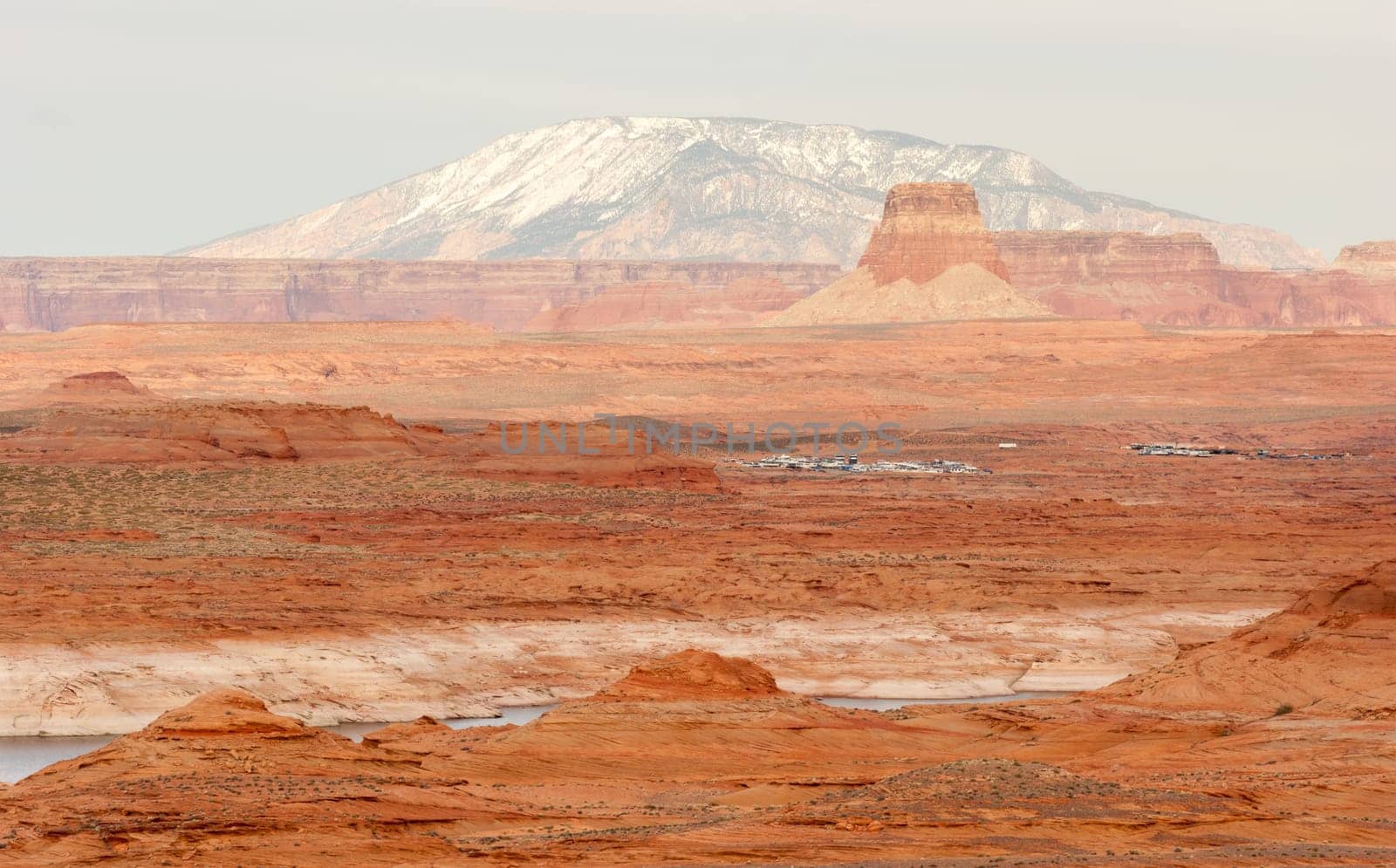 A boat storage lot is tucked away in the red rock landscape of lake powell