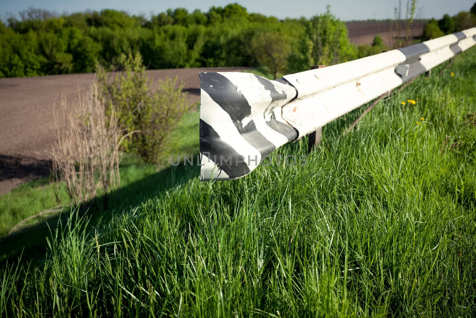 Closeup photo of bump stopper on side of country road
