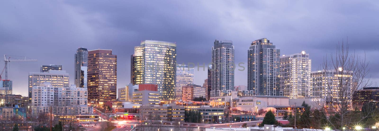 A clear panoramic view of Bellevue, WA with a storm passing at dusk