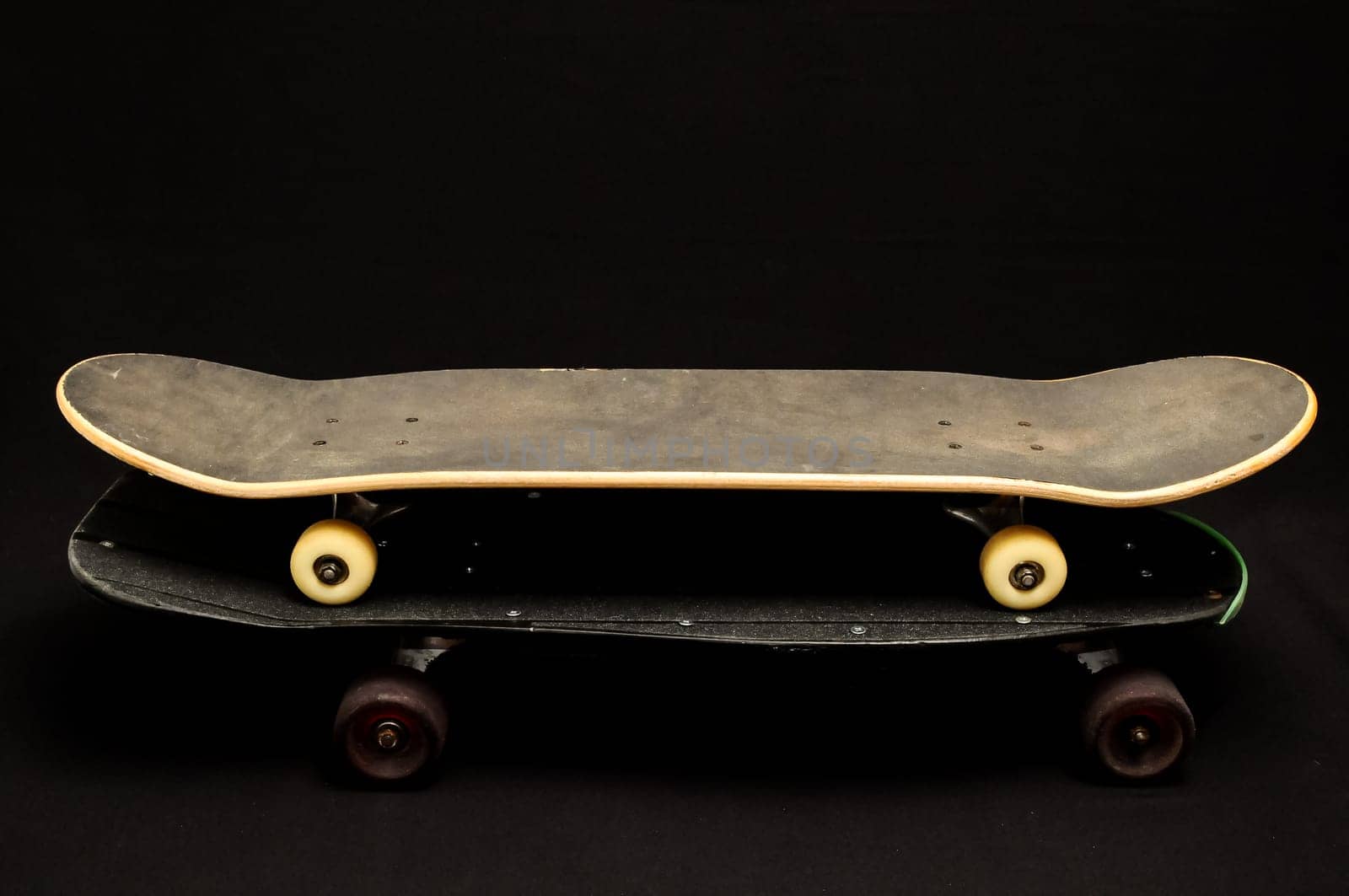 Vintage Style Black Skateboard on a black Background