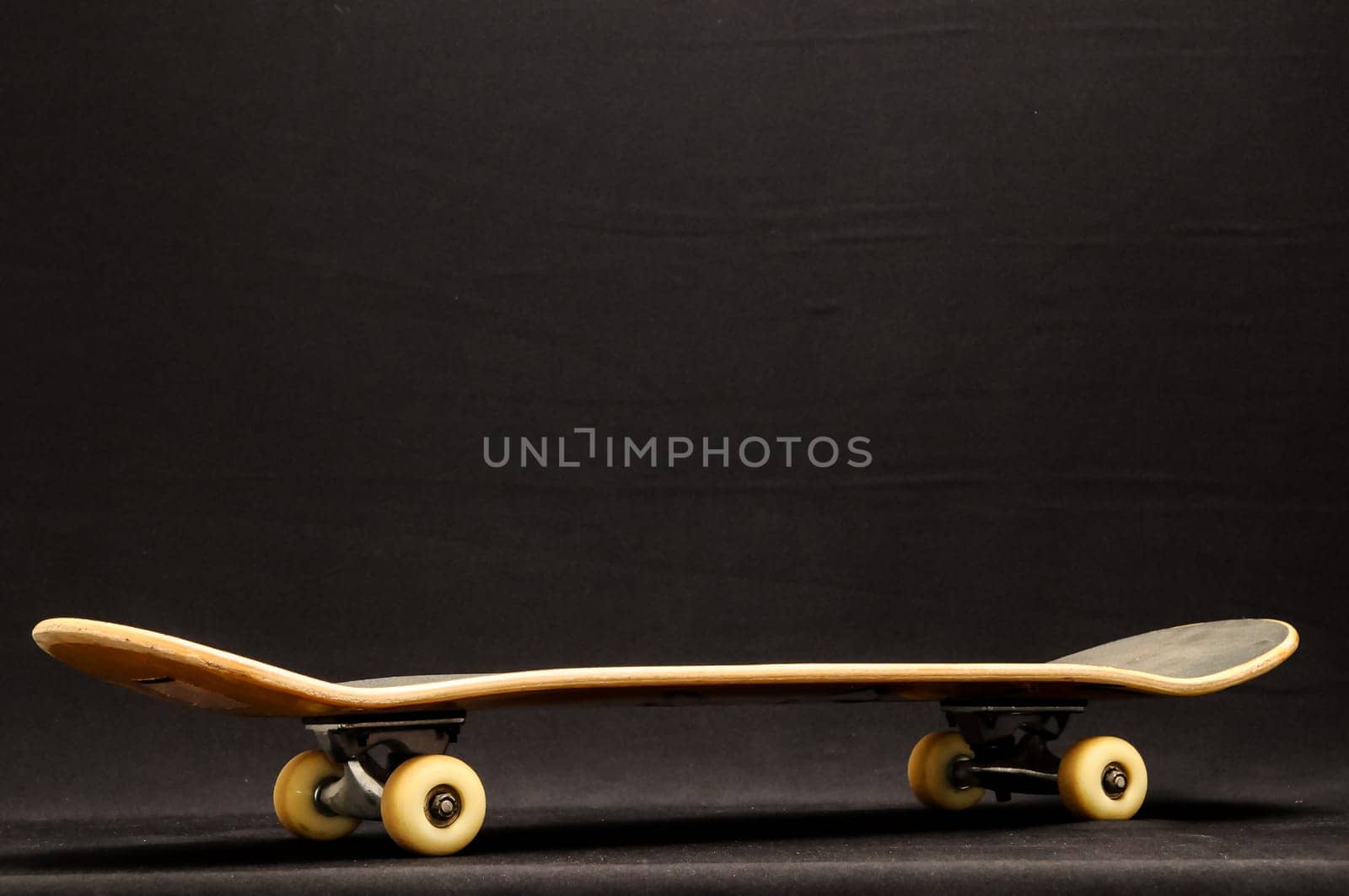 Vintage Style Black Skateboard on a black Background