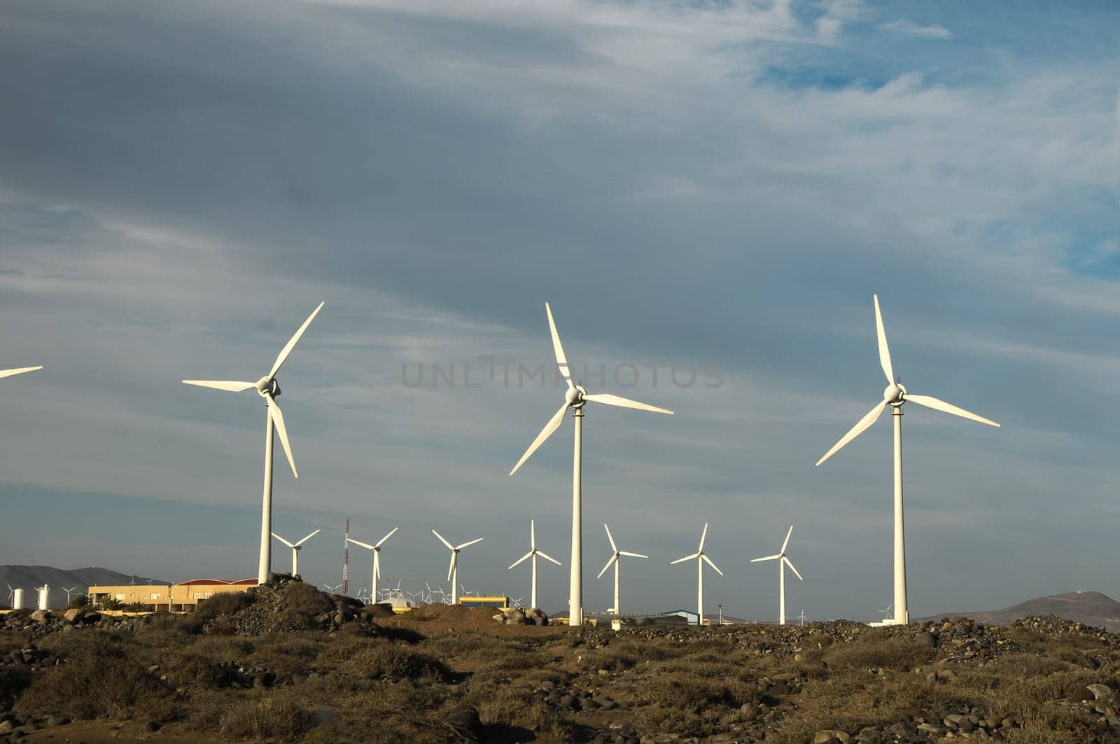 Eletric Power Generator Wind Turbine over a Cloudy Sky