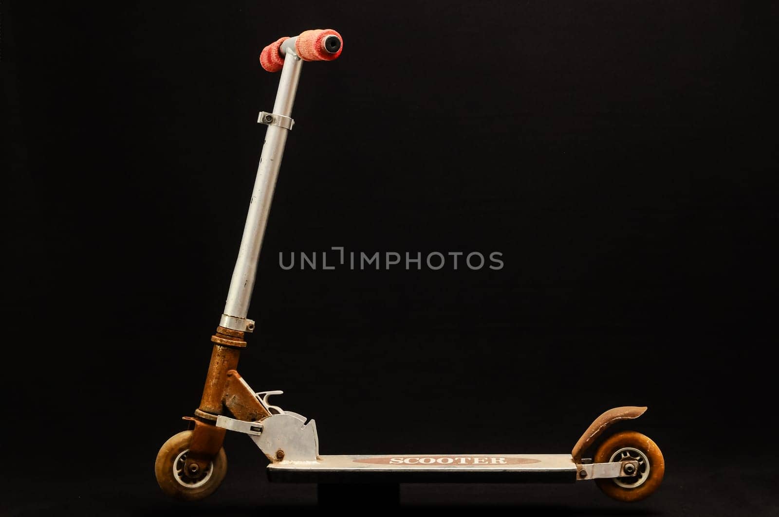 Metal scooter for child on white background