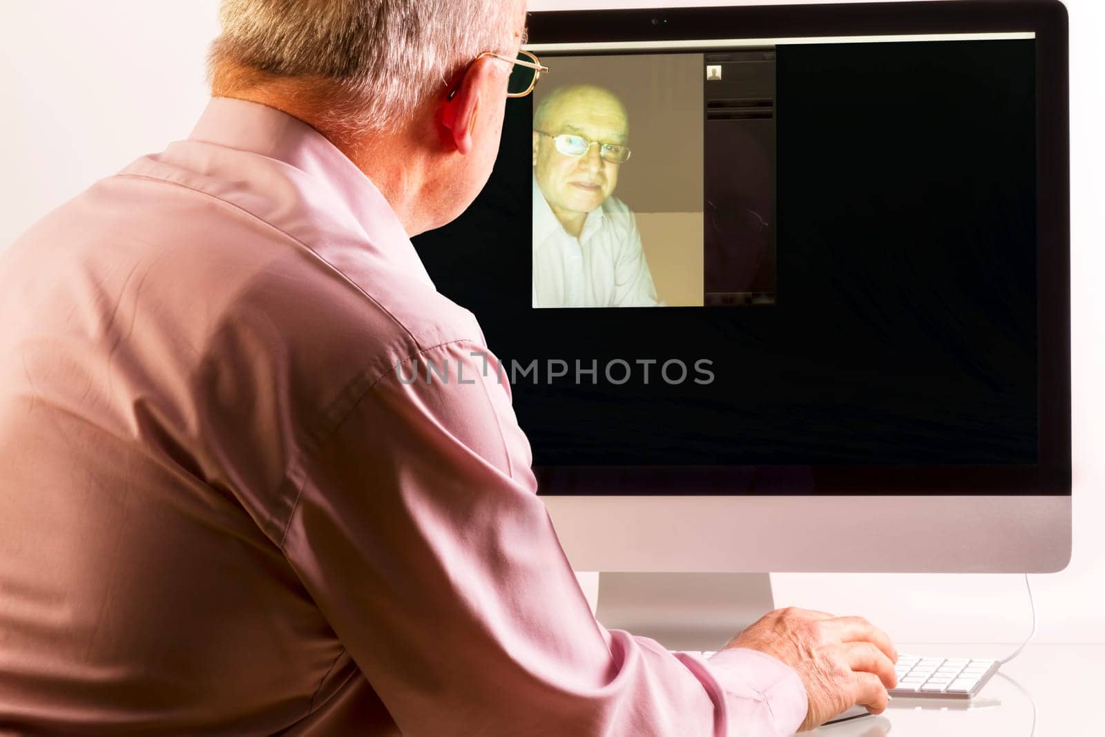 Man at computer on white background