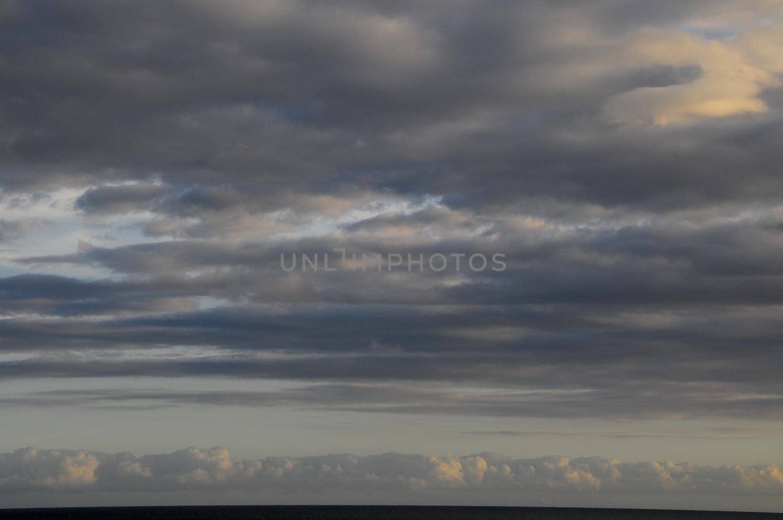 Cloudscape, Colored Clouds at Sunset near the Ocean