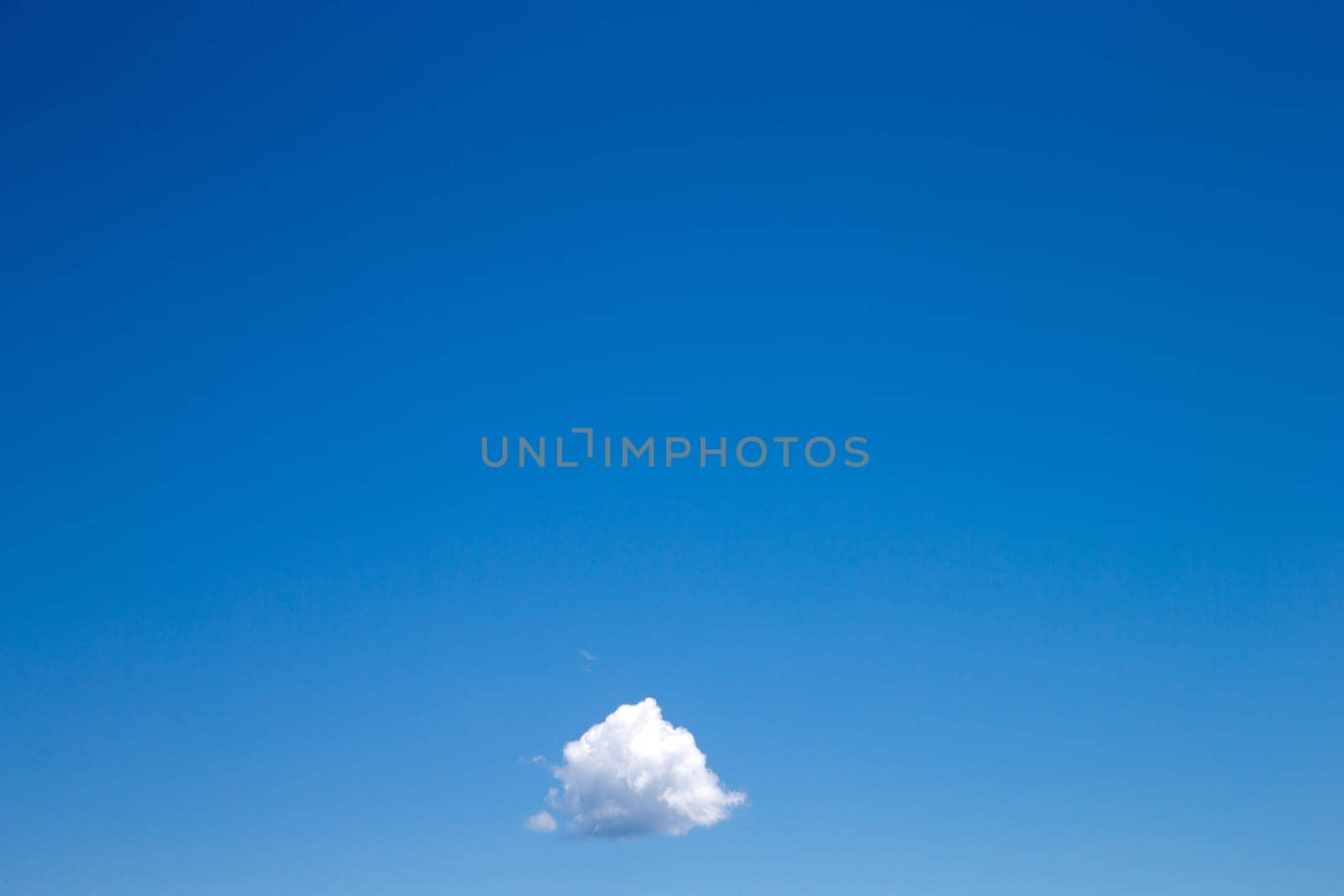 blue sky background with tiny clouds