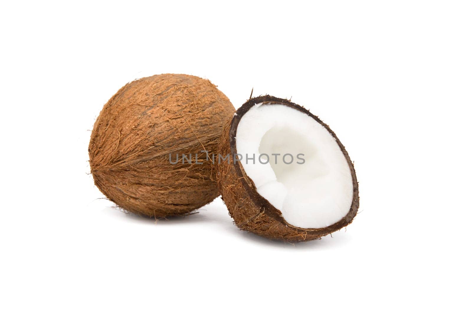 coconut cut in half on white background