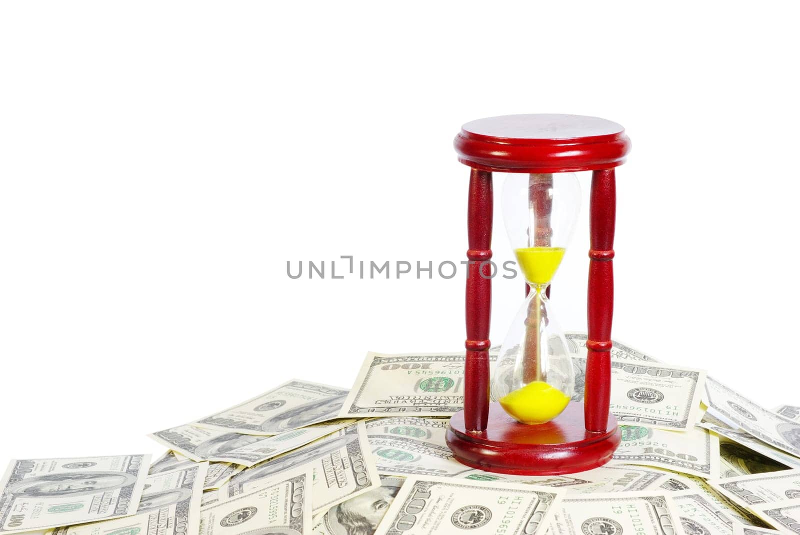 Sand glass with gold sand on dollar background