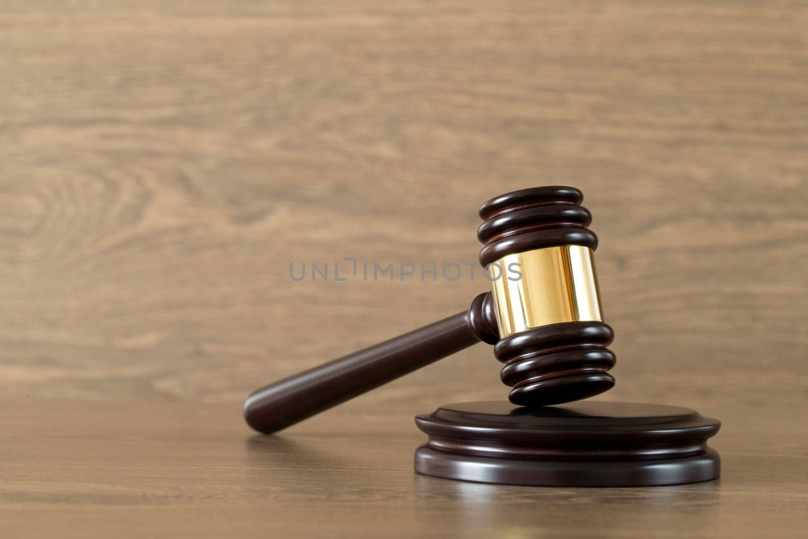judge gavel on the brown wooden background