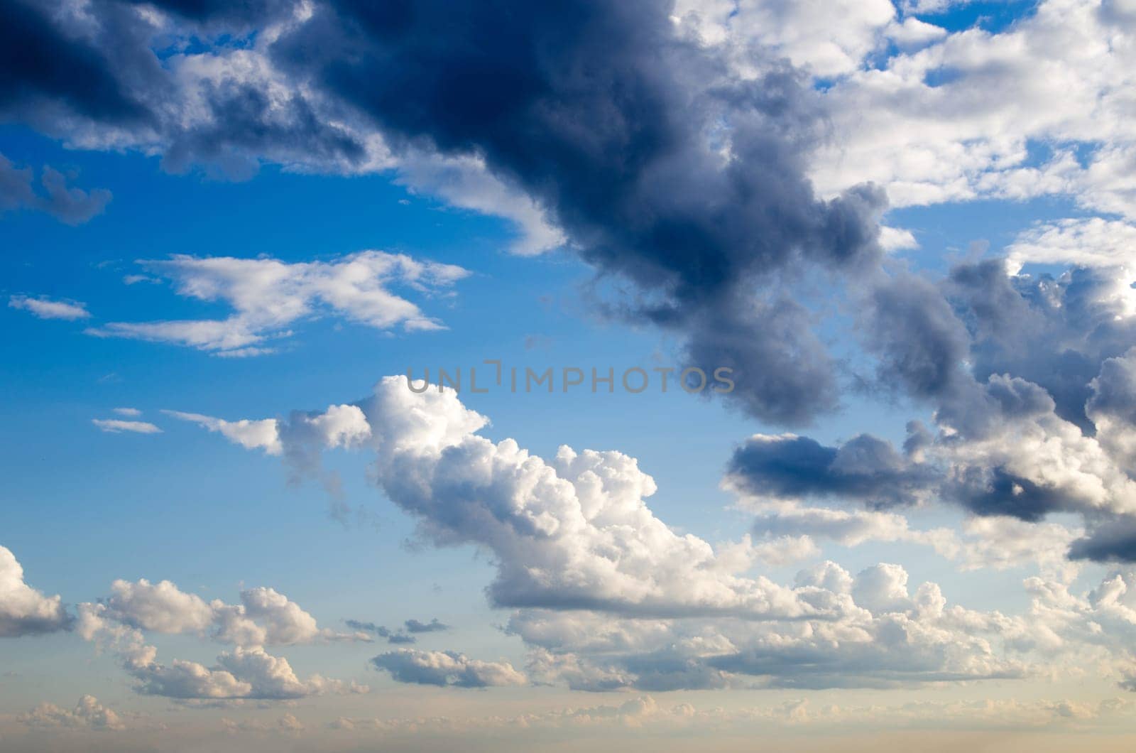 Blue sky background with a tiny clouds