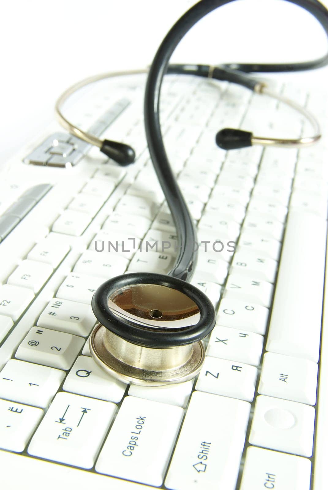 white computer keyboard with a stethoscope
