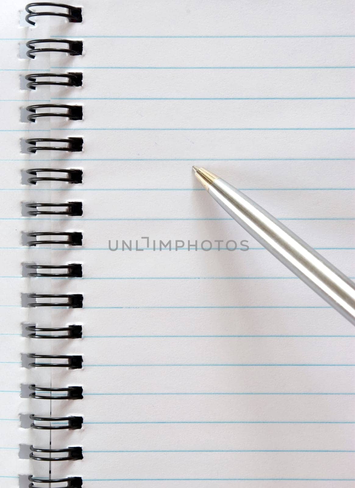 The notebook with the handle lays on a white background