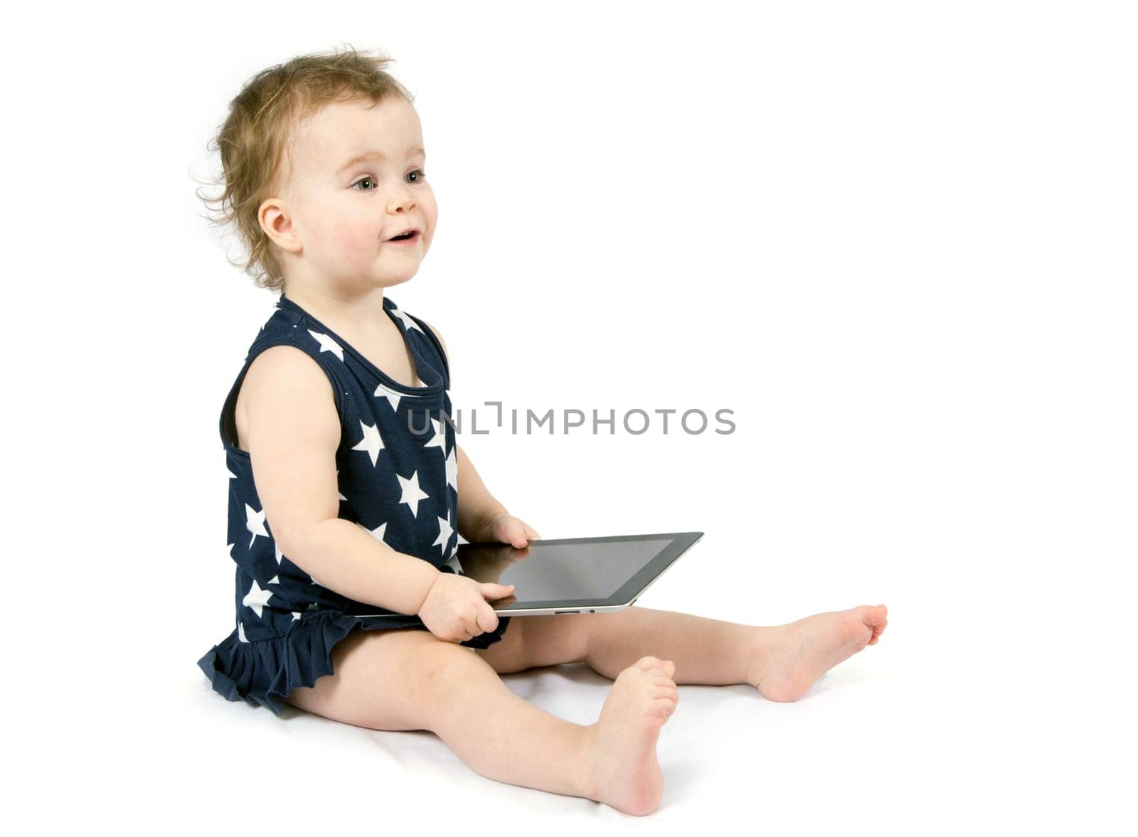 Baby girl playing with tablet