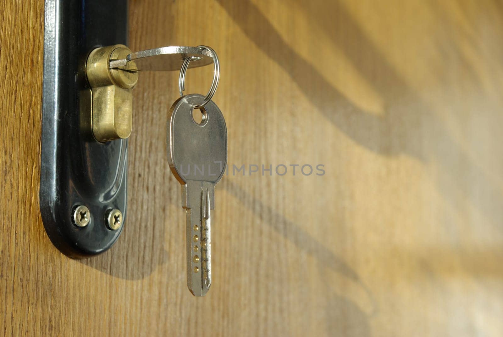 A hotel room door lock and key