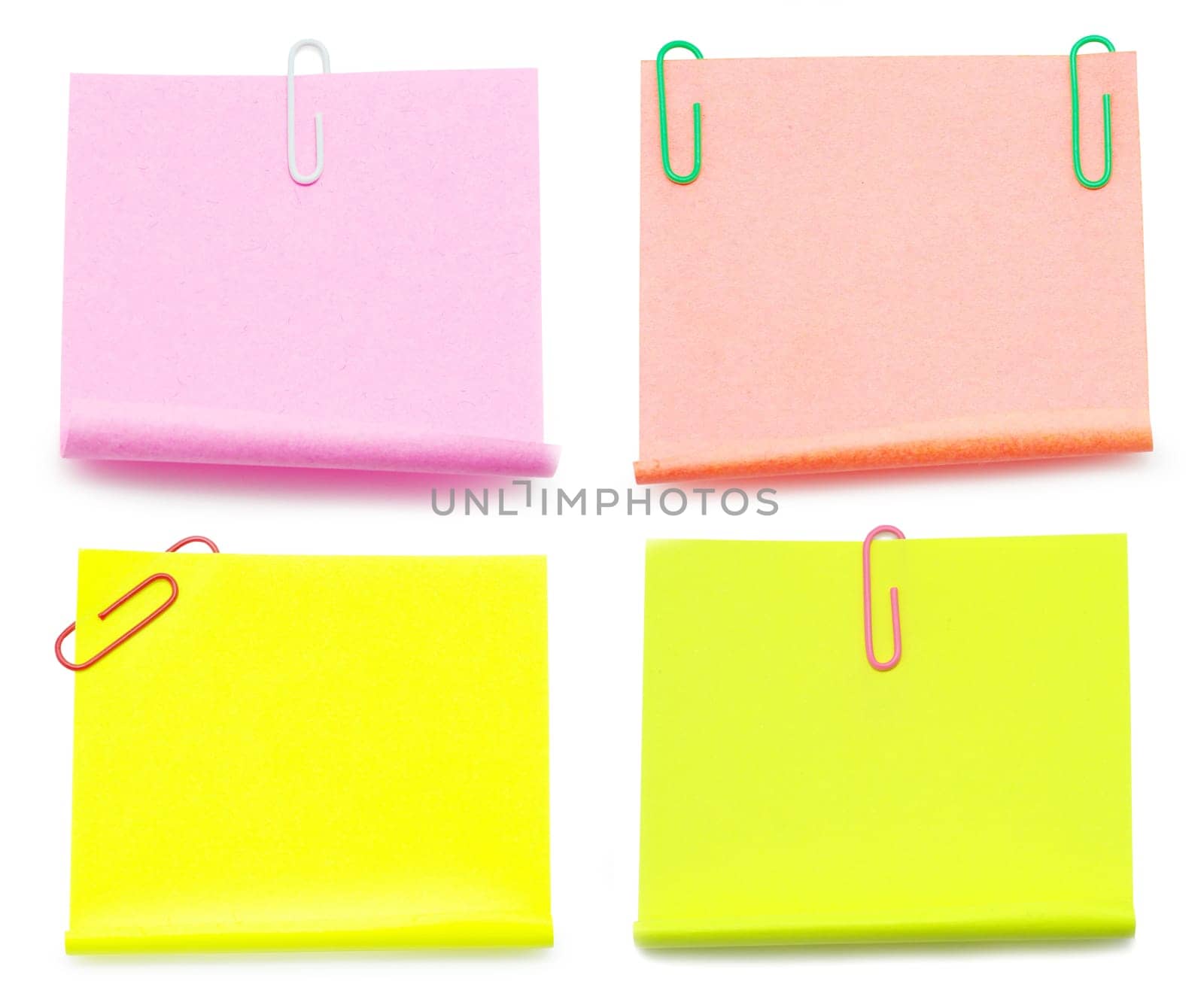 Blank note paper and red paper-clip isolated  on white
