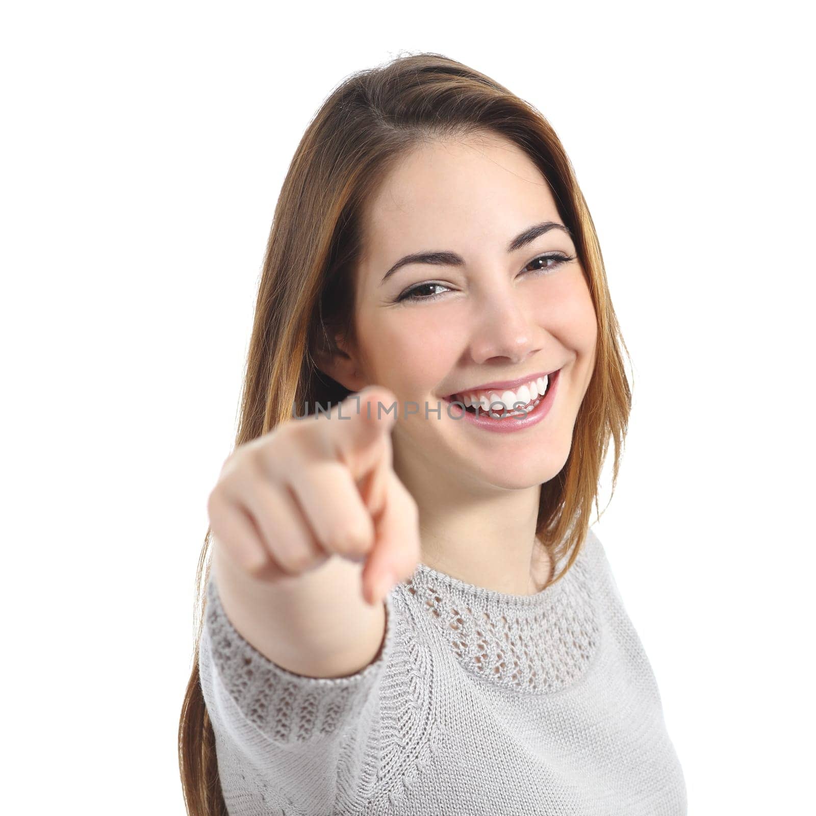 Happy woman with perfect smile pointing at camera isolated on a white background