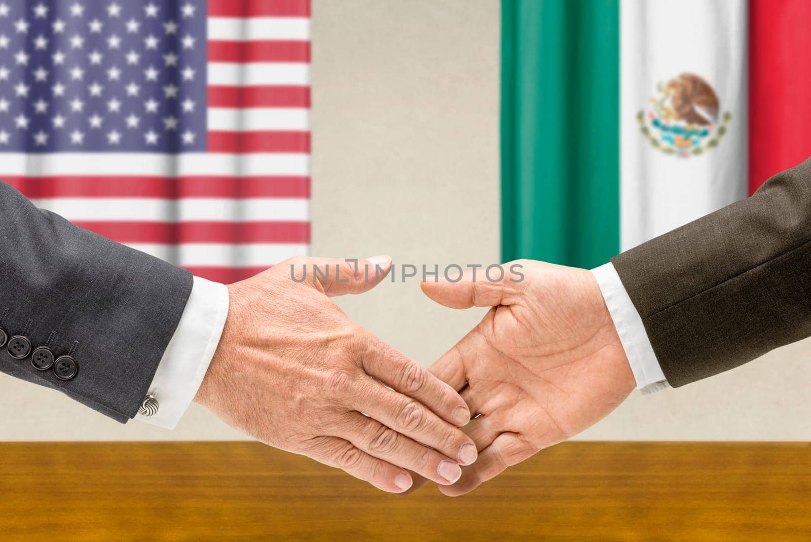 U.S. and Mexican officials shake hands
