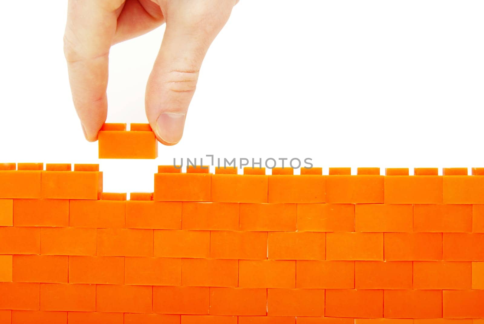 compleeting the wall on a white background