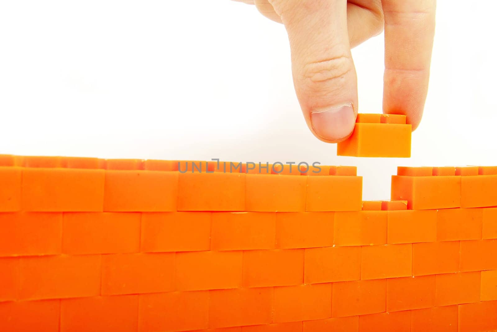 compleeting the wall on a white background