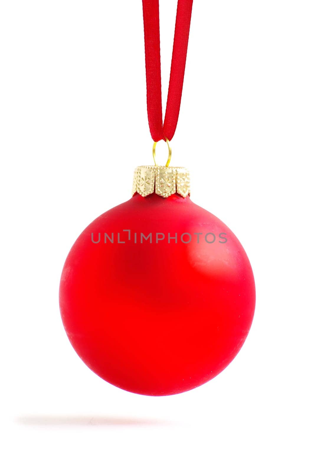Christmas ball hanging with ribbons on white background