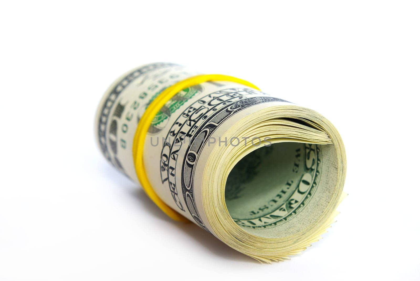 Roll of dollars close-up against white background.