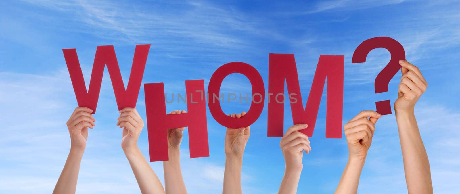 hands holding four pieces of a puzzle with copy space, gray background