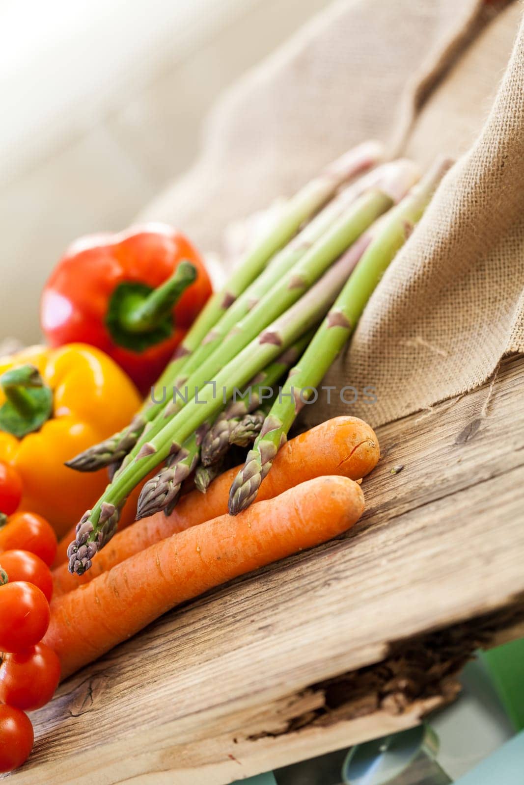 Fresh vegetables with tomatoes,peppers and asparagus as a close-up on an outdoor table