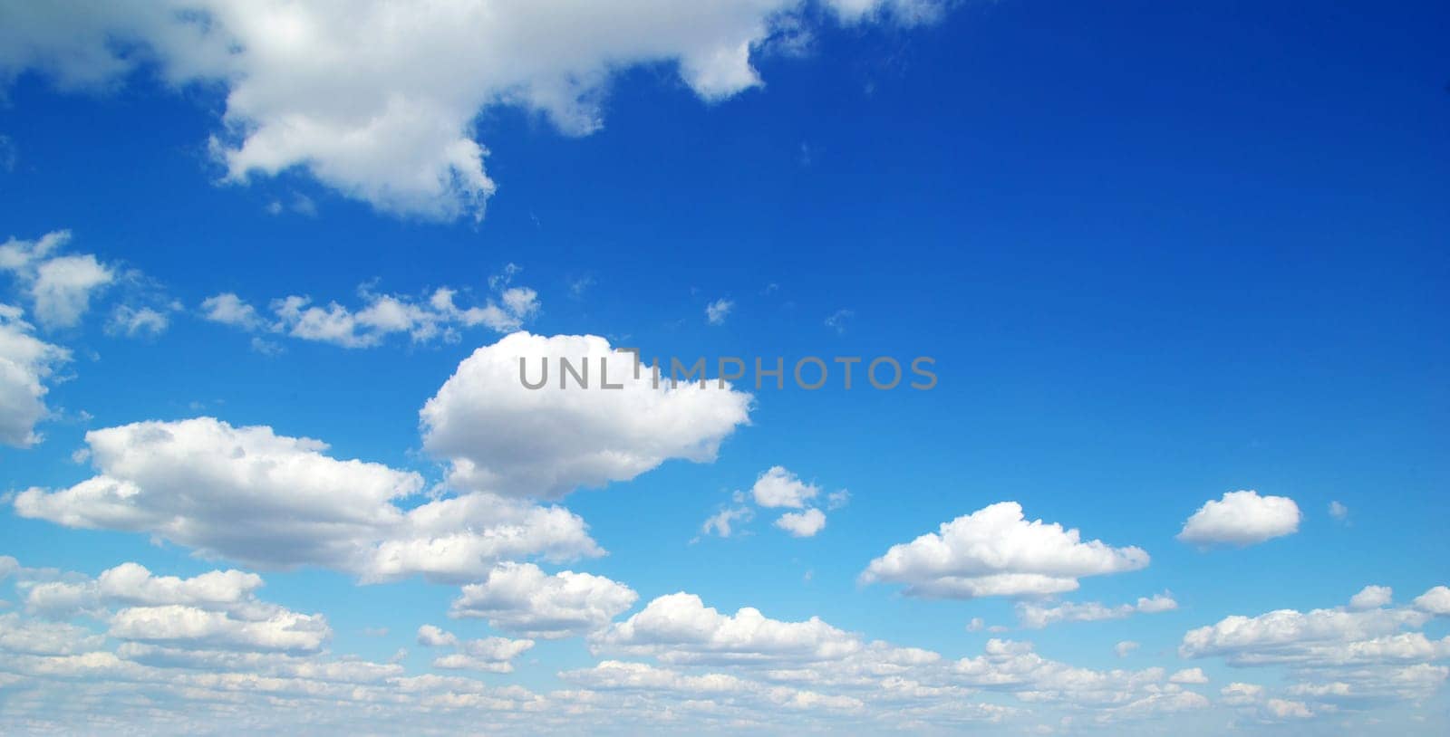blue sky background with tiny clouds