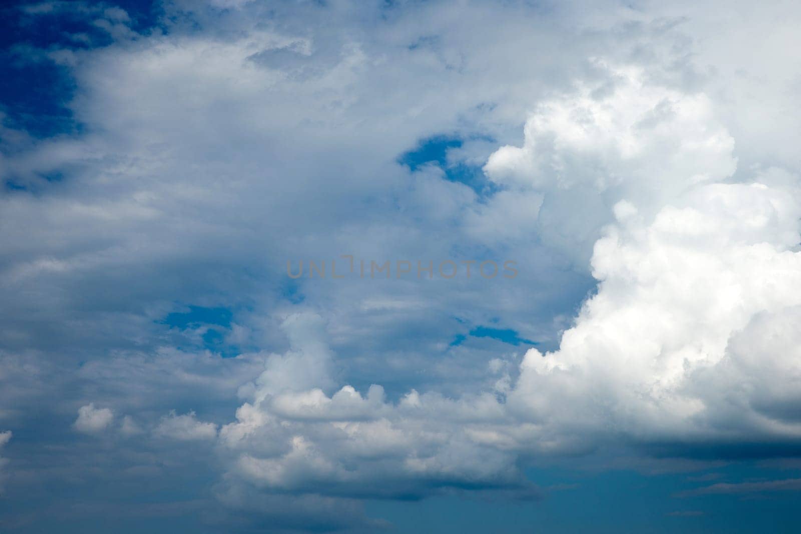 Blue sky background with a tiny clouds