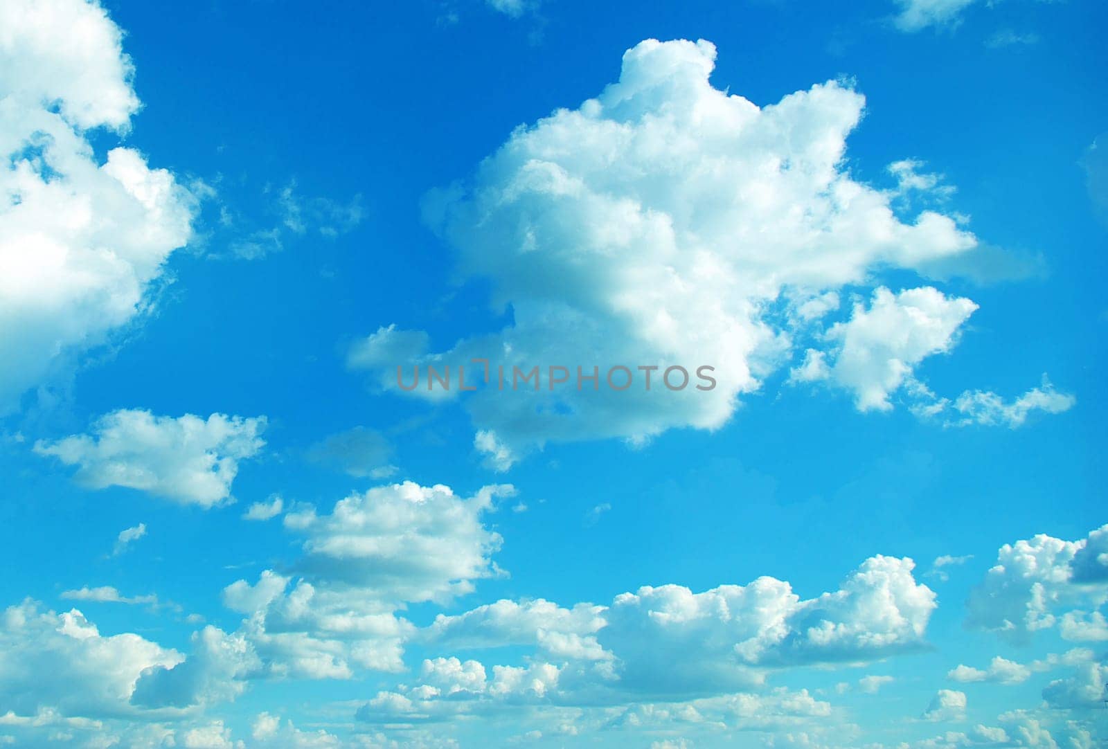 Blue sky background with a tiny clouds