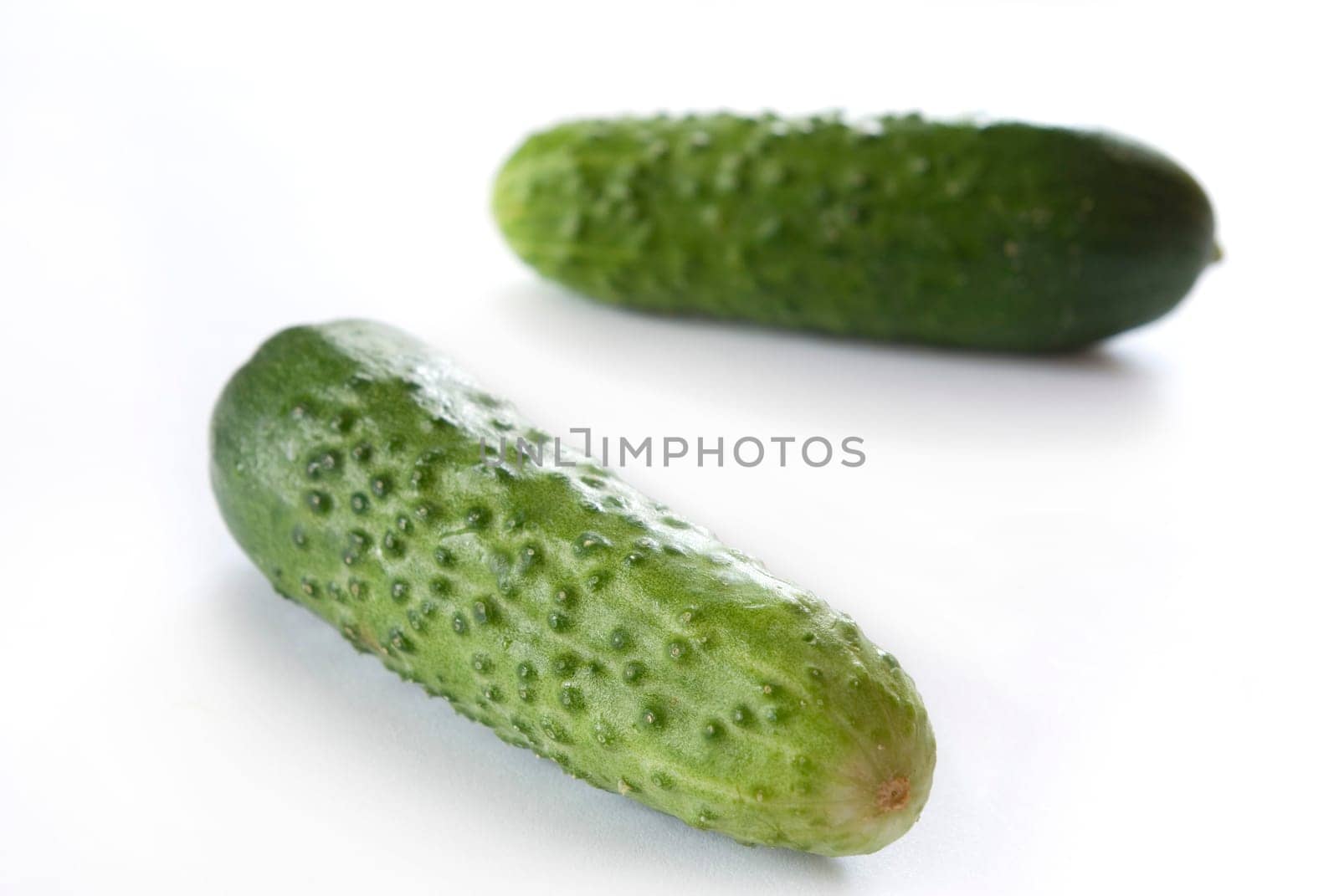 Cucumbers on the white background