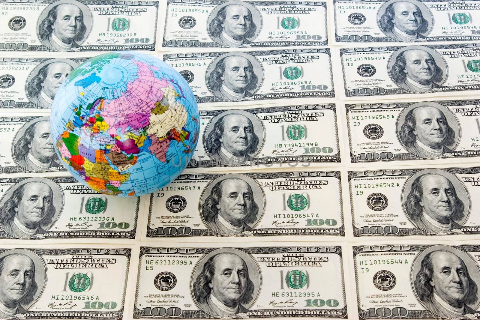 A globe and dollars is isolated on a whiteness
