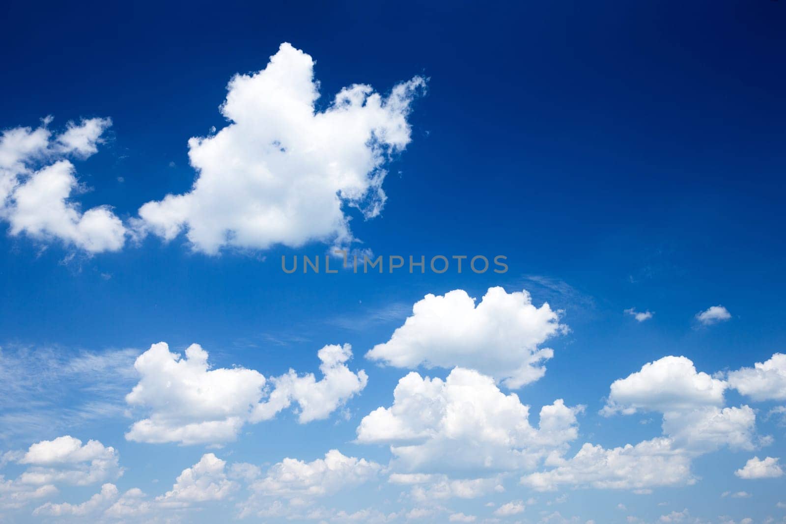 Blue sky background with a tiny clouds