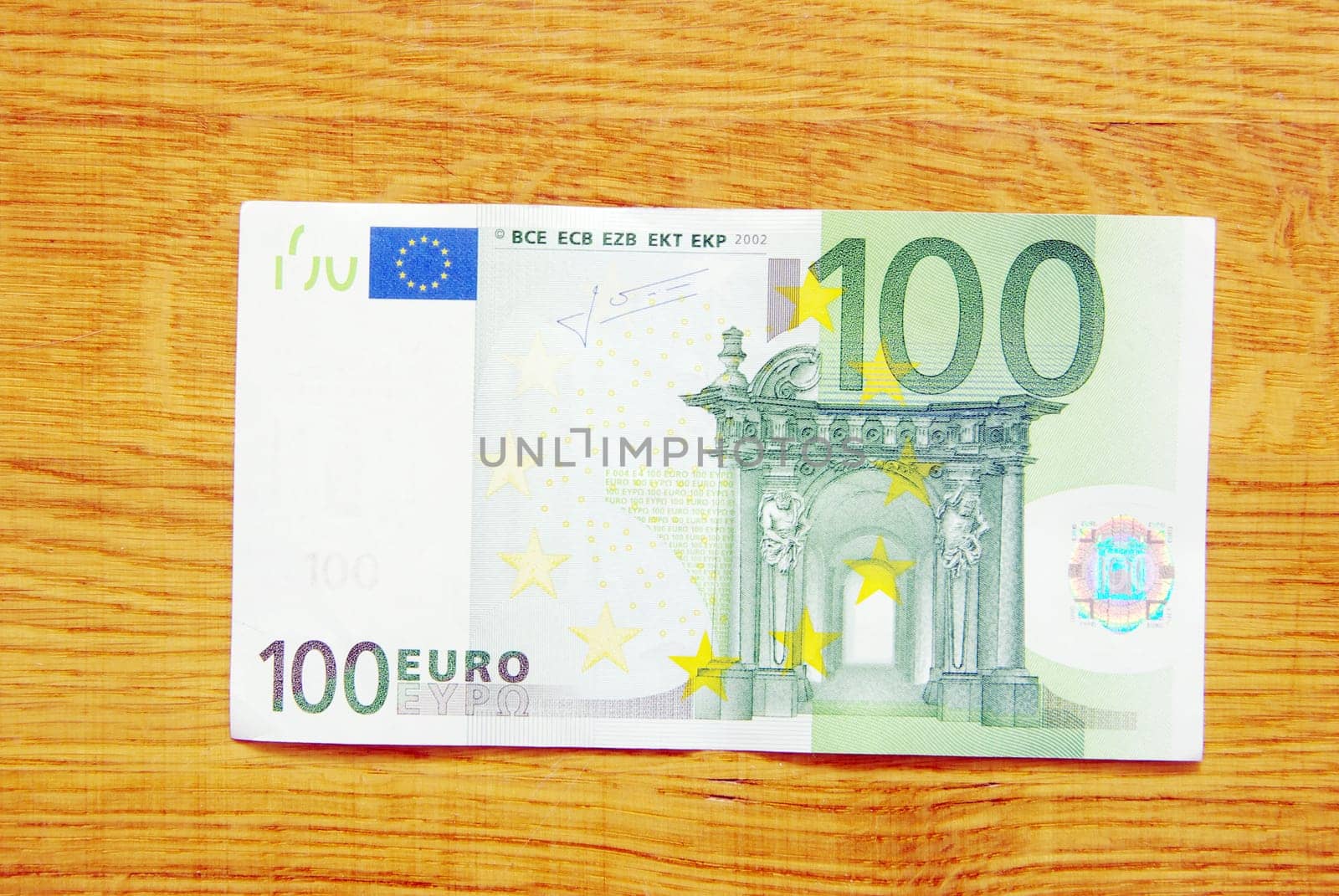 banknotes of euro isolated on a wood background