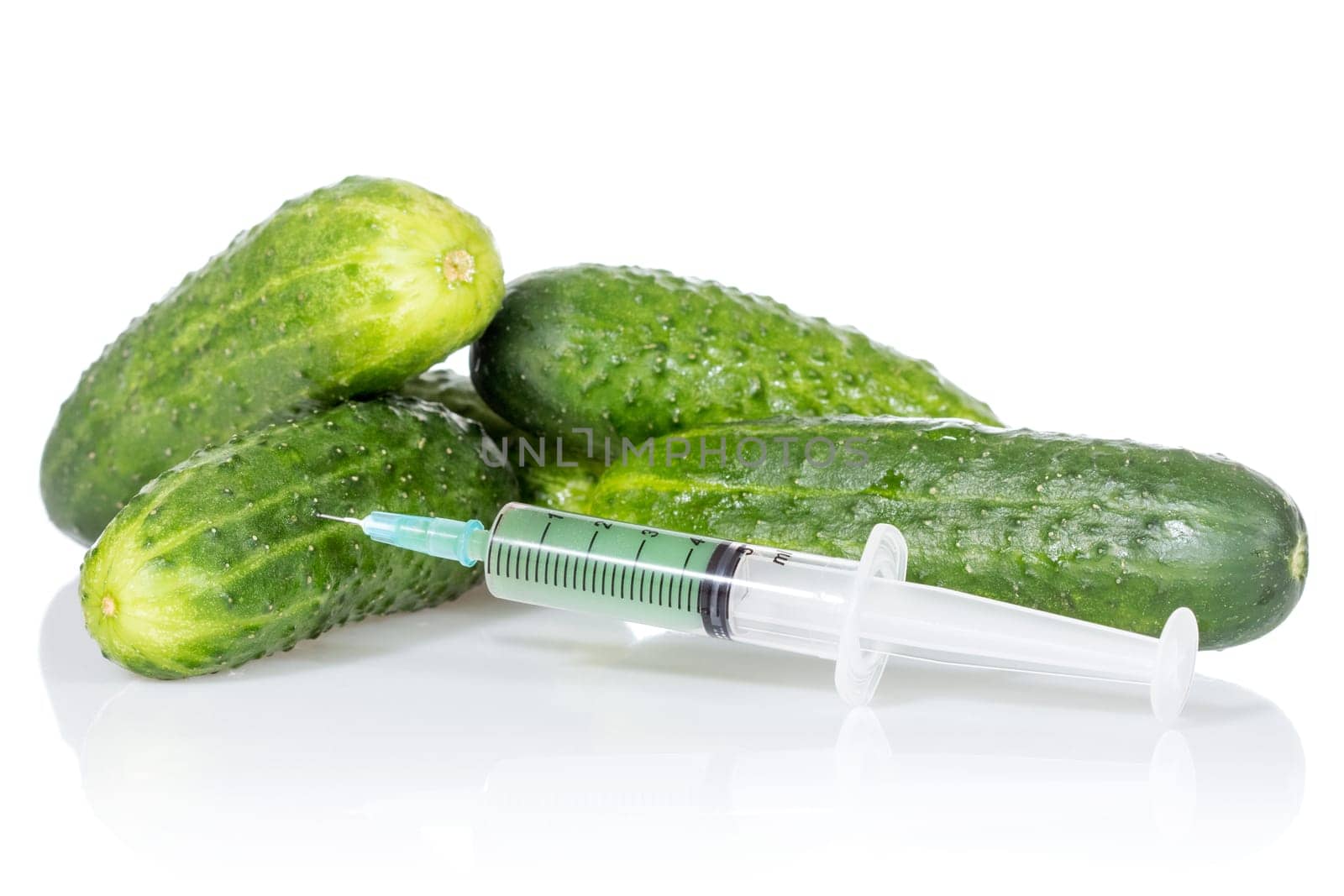 Injection into fresh cucumbers, isolated on white background