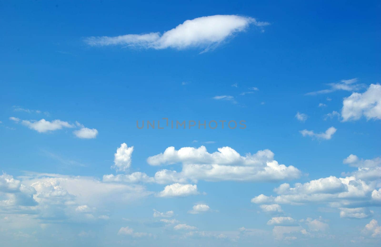 blue sky with clouds and sun