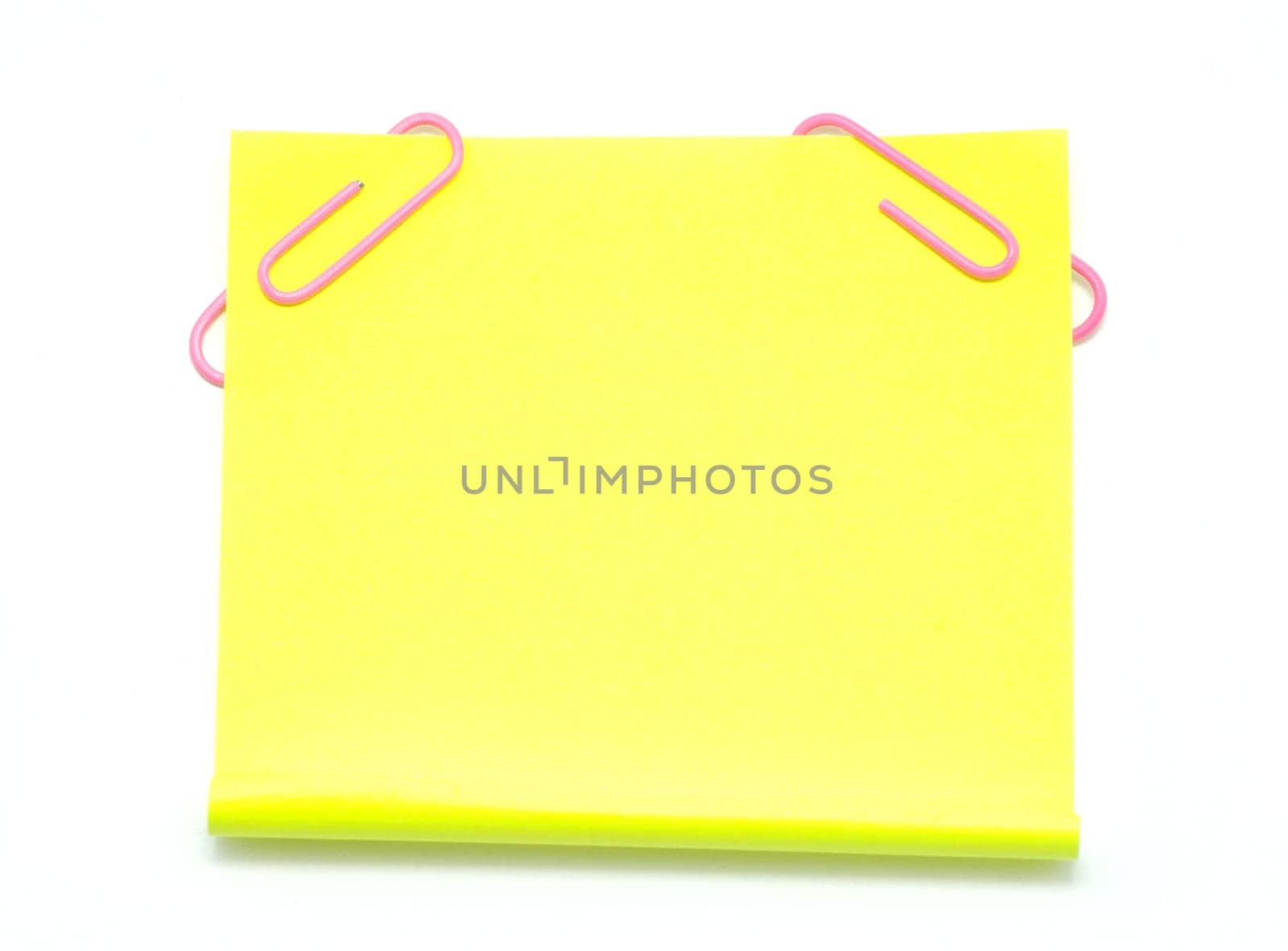 Blank note paper and red paper-clip isolated  on white