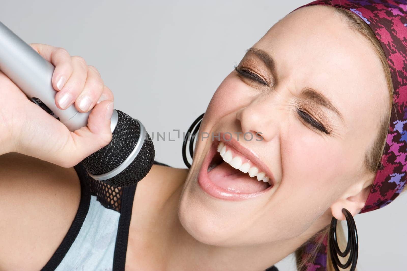 Beautiful young microphone singing girl