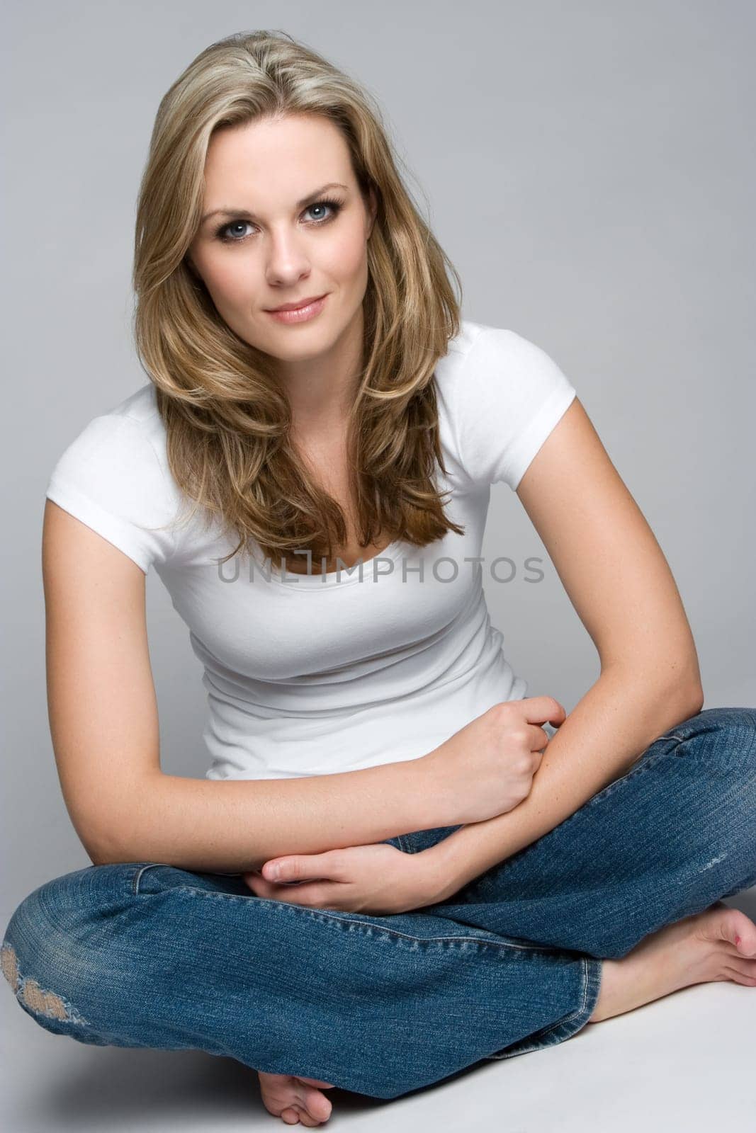 Beautiful sitting blond woman smiling