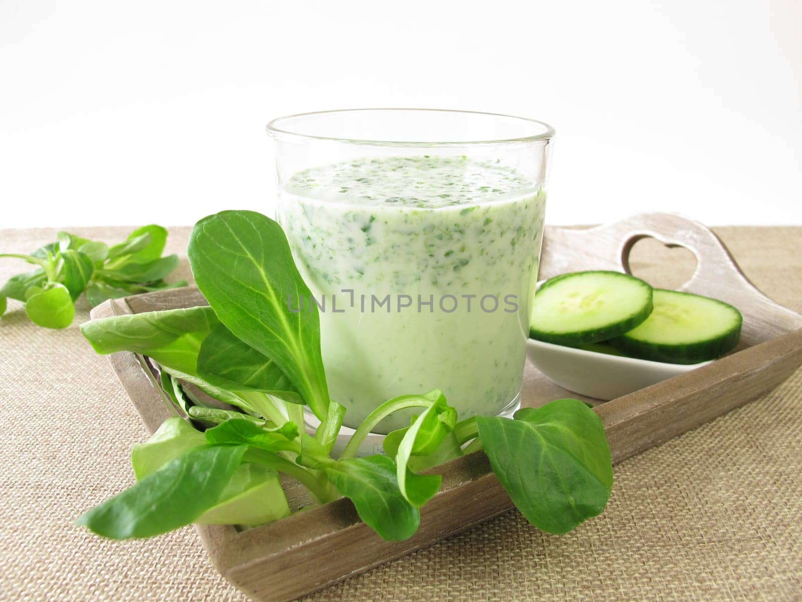 Green smoothie with field salad and cucumber