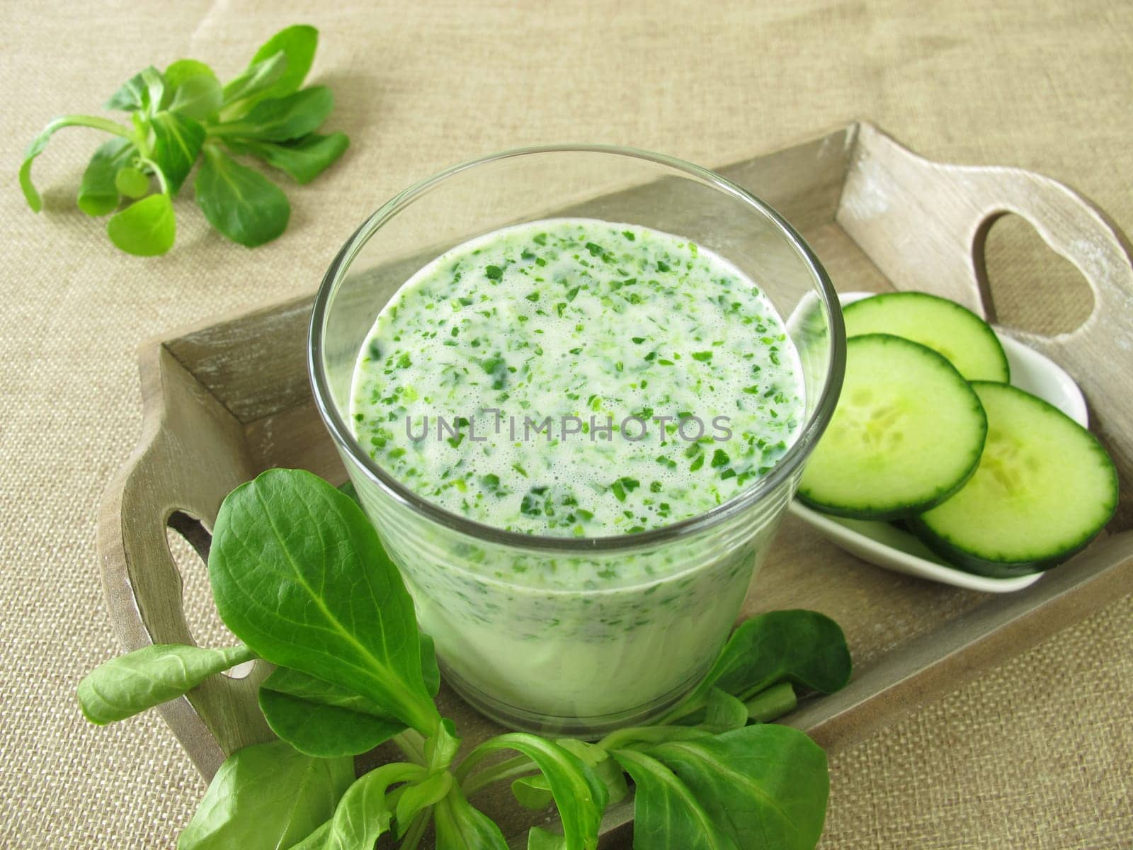 Green smoothie with field salad and cucumber