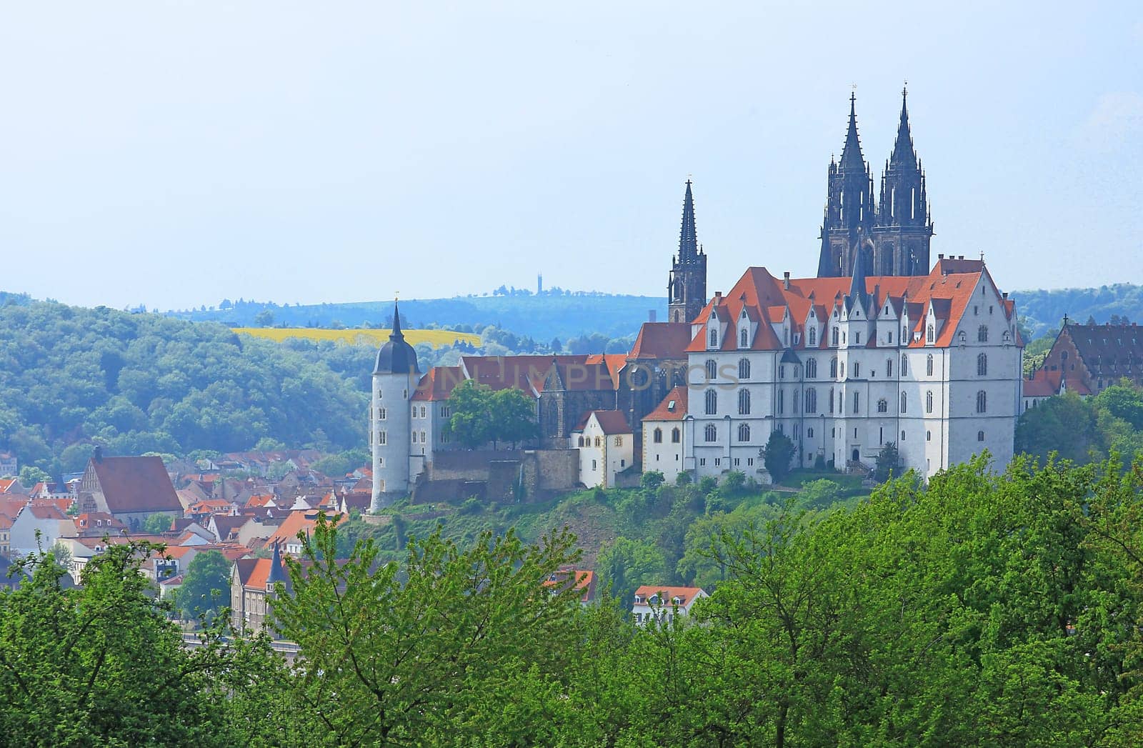 right: Albrechtsburg Meissen,to the left of it the round tower of the former bishop's castle (today district court),behind it the towers of the cathedral. Saxony. Germany.