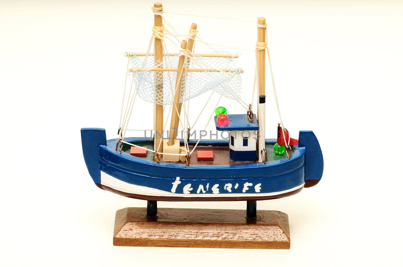 Beautiful miniature ship. Wooden sailship figurine. Antique model sailing boat isolated on white