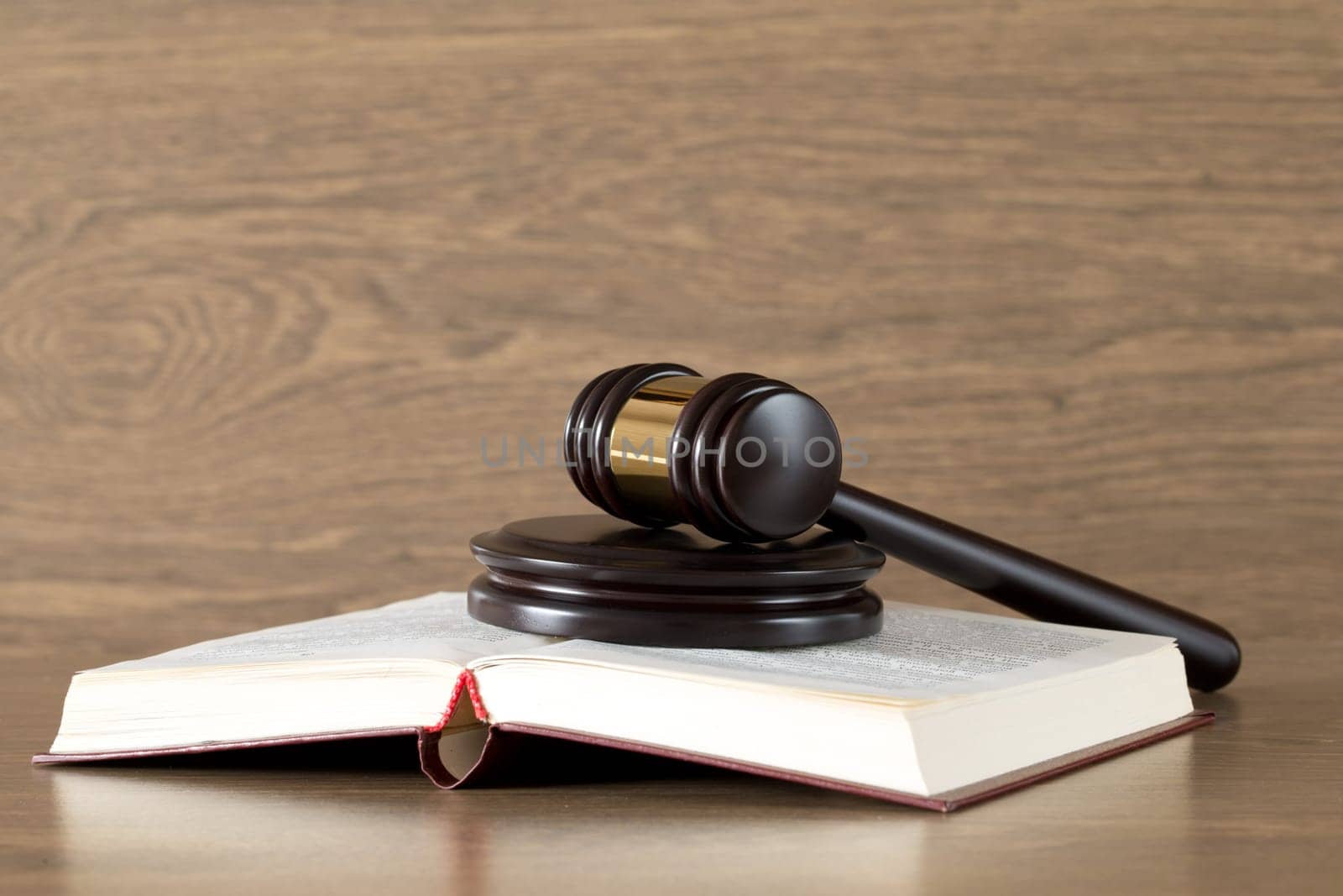 wooden gavel and books on wooden table